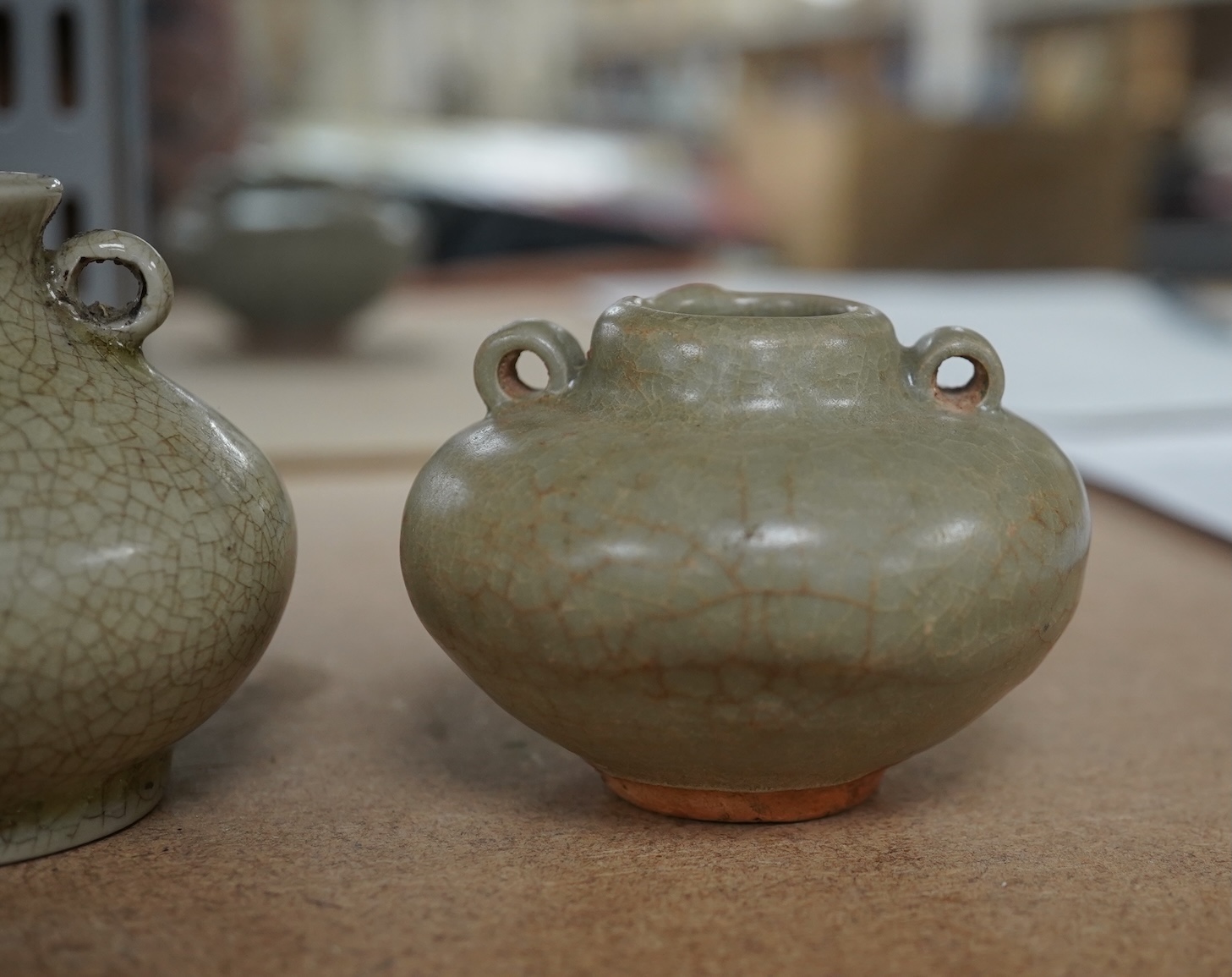 Two Chinese celadon jarlets, Yuan dynasty and a crackle glaze jarlet, tallest 6cm. Condition - good